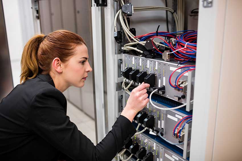 woman it expert assessing server health in boulder colorado