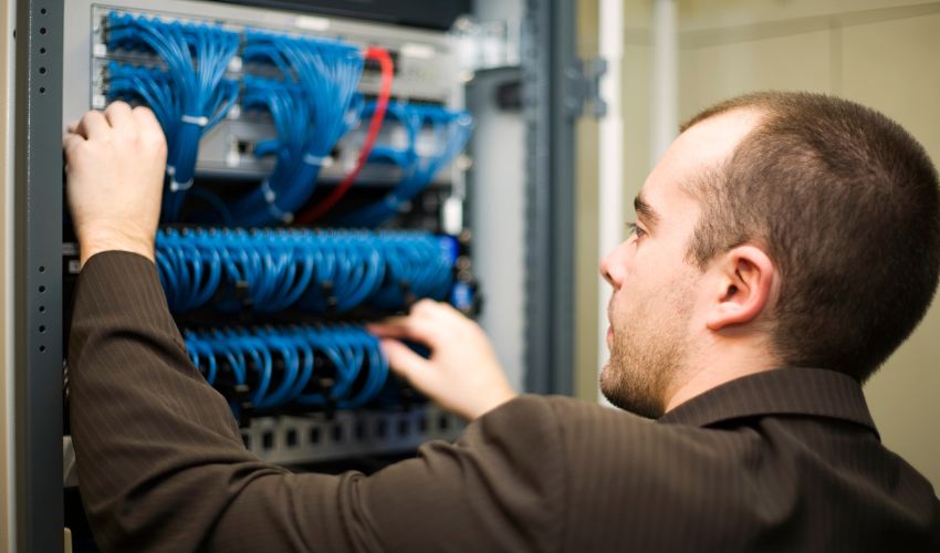 man evaluating the IT network servers in Boulder