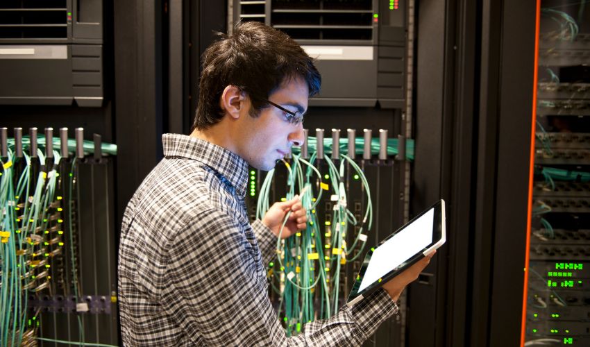 man checking company servers for it issues in Denver